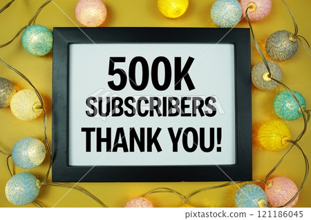 Thanks 500000, 500K subscribers text written on blackboard with LED cotton balls decoration on yellow background Thanks 500000, 500K subscribers text written on blackboard with LED cotton balls decoration on yellow background 121186045