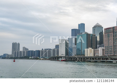 Hong Kong Island's waterfront lined with high-rise residential buildings Hong Kong Island's waterfront lined with high-rise residential buildings 121186144