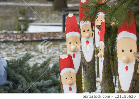 Festive Wooden Santa Decorations in Nature Festive Wooden Santa Decorations in Nature 121186620