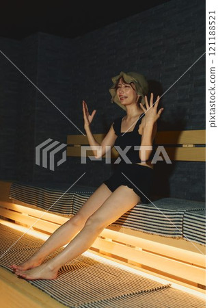 A woman taking a sauna. Photo courtesy of Shiratama no Yu Izumikei. A woman taking a sauna. Photo courtesy of Shiratama no Yu Izumikei. 121188521