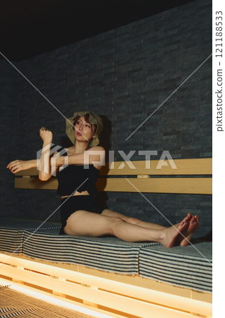 A woman stretching in a sauna. Photo courtesy of Shiratama no Yu Izumikei A woman stretching in a sauna. Photo courtesy of Shiratama no Yu Izumikei 121188533