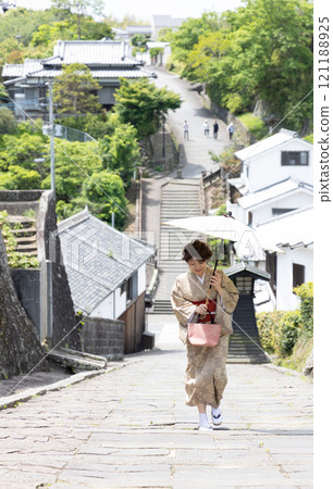 A woman walking up the slope of Suya 121188925