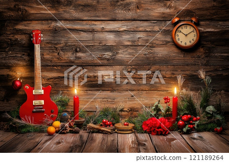 A beautifully arranged festive Christmas scene featuring a guitar and flickering candles 121189264