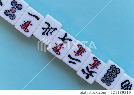 mahjong tiles lined up 121189819