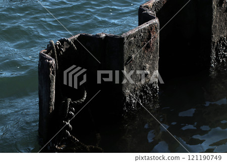 Landscape art texture of blue sea surface and rusty old steel sheet pile in harbor Landscape art texture of blue sea surface and rusty old steel sheet pile in harbor 121190749
