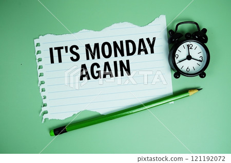 It's Monday Again text written on paper card with alarm clcok on green background 121192072