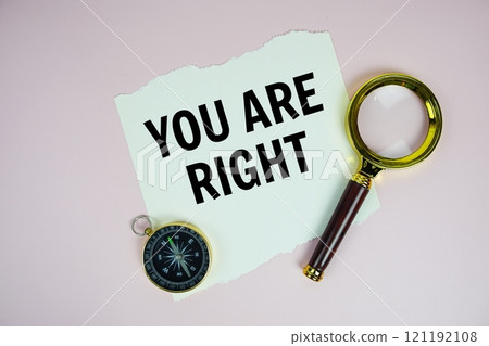 You Are Right text motivational and inspiration quote with compass and magnifying glass on pink background You Are Right text motivational and inspiration quote with compass and magnifying glass on pink background 121192108