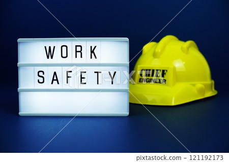 Work Safety letterboard text on LED Lightbox on blue background 121192173