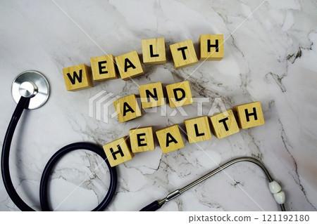 Wealth and Health with wooden blocks alphabet letters and stethoscope on marble background Wealth and Health with wooden blocks alphabet letters and stethoscope on marble background 121192180