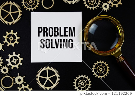 Problem Solving text with magnifying glass on black background Problem Solving text with magnifying glass on black background 121192269