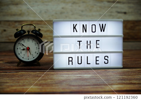 KNOW THE RULES letterboard text on LED Lightbox on wooden background, Business and Communication concept background KNOW THE RULES letterboard text on LED Lightbox on wooden background, Business and Communication concept background 121192360