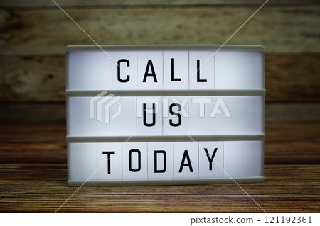 CALL US TODAY letterboard text on LED Lightbox on wooden background, Business and Communication concept background CALL US TODAY letterboard text on LED Lightbox on wooden background, Business and Communication concept background 121192361