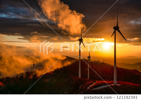 Windmills at Kamiyahagi Wind Farm as seen from the observation deck at dusk 121192391