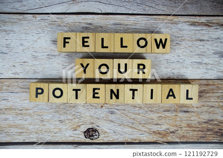 Fellow your potential with wooden blocks alphabet letterstop view on wooden background Fellow your potential with wooden blocks alphabet letterstop view on wooden background 121192729