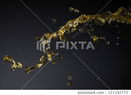 Splash of yellow transparent liquid. Splash of yellow transparent liquid. 121192773