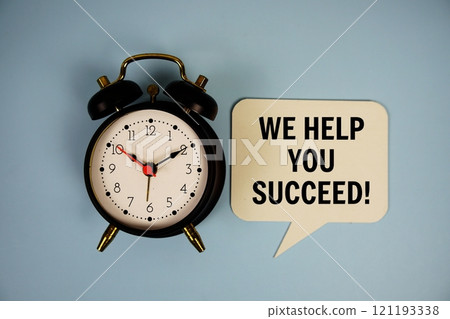 Why now? text on speech bubble with alarm clock top view on blue background Why now? text on speech bubble with alarm clock top view on blue background 121193338