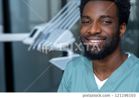 Dentist preparing for oral examination in clinic setting Dentist preparing for oral examination in clinic setting 121196103