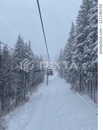 Snowy Ski Lift in Winter Forest 121196259