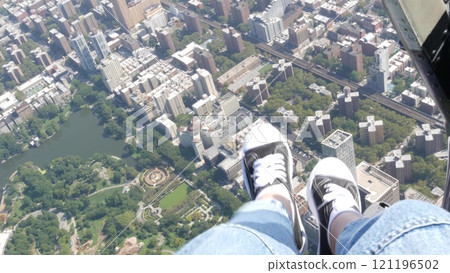 New York City doors off helicopter flight, Manhattan USA. Feet in sneakers, legs in shoes selfie pov 121196502