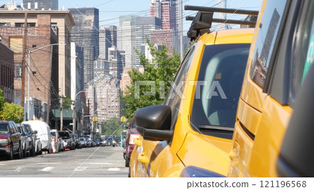 New York City. Row of yellow Taxi cars on street, Queens. Taxi cabs, Long Island. Medallion taxicab. New York City. Row of yellow Taxi cars on street, Queens. Taxi cabs, Long Island. Medallion taxicab. 121196568