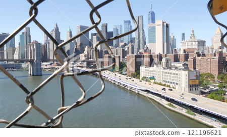 Brooklyn Bridge from Manhattan Bridge. New York City downtown skyline, financial district cityscape. 121196621
