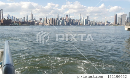 New York City skyline from ferry boat. Manhattan midtown, Empire State, Chrysler Building, USA. 121196632