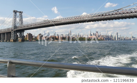 New York City skyline from ferry boat. Manhattan midtown, East river, Williamsburg Bridge, USA. 121196639