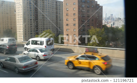 New York City subway train on bridge. Manhattan metro transport, metropolitan traffic. Shaking window 121196721
