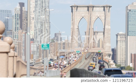 Cars on Brooklyn Bridge. New York City Manhattan skyline, downtown cityscape. Road traffic, people. Cars on Brooklyn Bridge. New York City Manhattan skyline, downtown cityscape. Road traffic, people. 121196723
