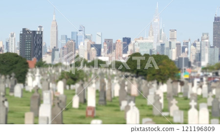 New York City Calvary cemetery in Queens, USA. Manhattan Midtown skyline. Tombstones on graves. 121196809