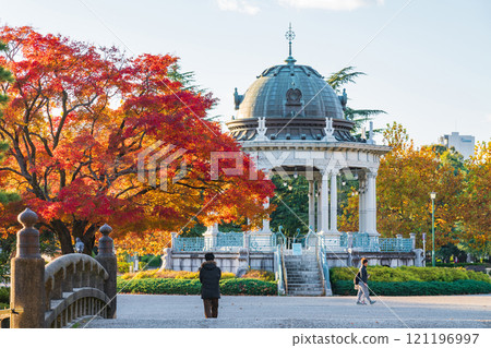 Tsuruma Park's Concert Hall and yellow-colored plane trees (Nagoya City, Aichi Prefecture) 121196997