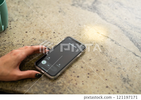 Fraud or fraudulent schemes. Close-up of a woman's hand holding a phone with an unexpected incoming call from an unknown person 121197171
