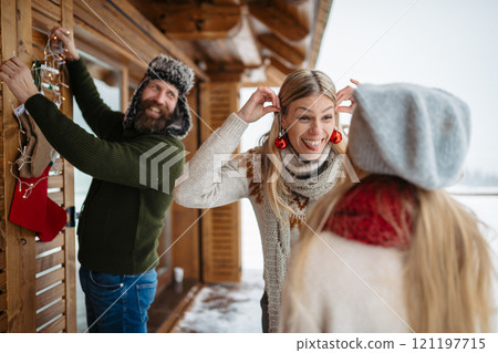 Family is decorating the house with Christmas decorations. Celebrating Christmas and New Year. 121197715
