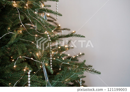 Elegant Christmas Tree Adorned with Lights and Beads 121199003