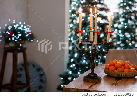 Cozy Christmas Table Setting with Candleholders and Oranges 121199026