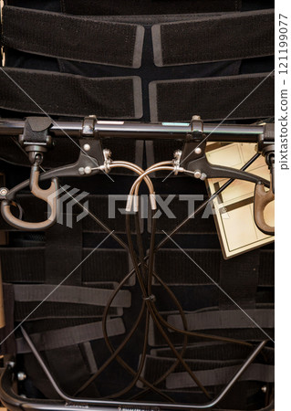 Intricate System of Harnesses and Attachments on a Wheelchair Intricate System of Harnesses and Attachments on a Wheelchair 121199077