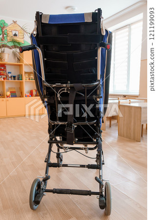 A Sturdy Blue Baby Stroller from the Rear View in a Bright Room A Sturdy Blue Baby Stroller from the Rear View in a Bright Room 121199093