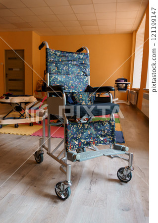 Colorful Wheelchair Designed for Comfort and Functionality in a Bright Room 121199147