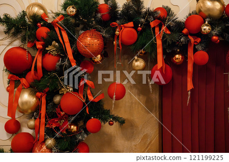 Festive Holiday Wreath Decorated with Red and Gold Ornaments Festive Holiday Wreath Decorated with Red and Gold Ornaments 121199225