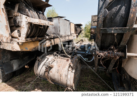 Rusty Machinery in Abandoned Agricultural Setting 121199371