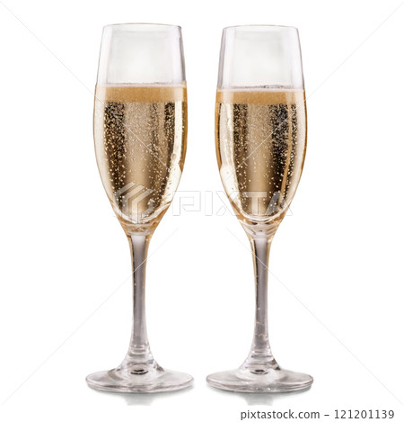 Celebratory champagne flutes filled with bubbly drink on a white background 121201139