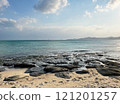 A tranquil coastal landscape with rocks and sandy beaches 121201257