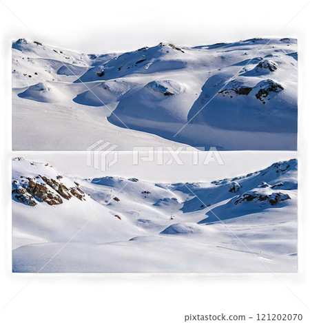 Snow-covered mountain landscape with gentle slopes and clear blue sky in winter 121202070