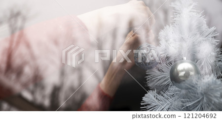 Decorating the white Christmas tree Decorating the white Christmas tree 121204692