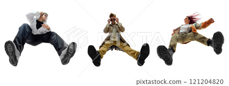 Group of young people dressed in modern streetwear, dynamically posing against white background. Bottom view 121204820