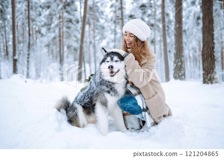A young woman with her pet on an adventure. Friendship concept, pets. 121204865