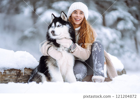 A young woman with her pet on an adventure. Friendship concept, pets. 121204872