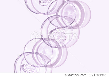 A sample of skin serum or moisturizing gel in a Petri dish. A cosmetic product. A sample of skin serum or moisturizing gel in a Petri dish. A cosmetic product. 121204986
