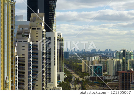 View from above of luxurious highrise hotels and condos on Atlantic ocean shore in Sunny Isles Beach city. American tourism infrastructure in southern Florida 121205007