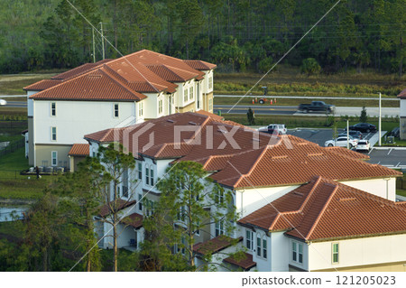 View from above of apartment residential condos in Florida suburban area. American condominiums as example of real estate development in USA suburbs View from above of apartment residential condos in Florida suburban area. American condominiums as example of real estate development in USA suburbs 121205023